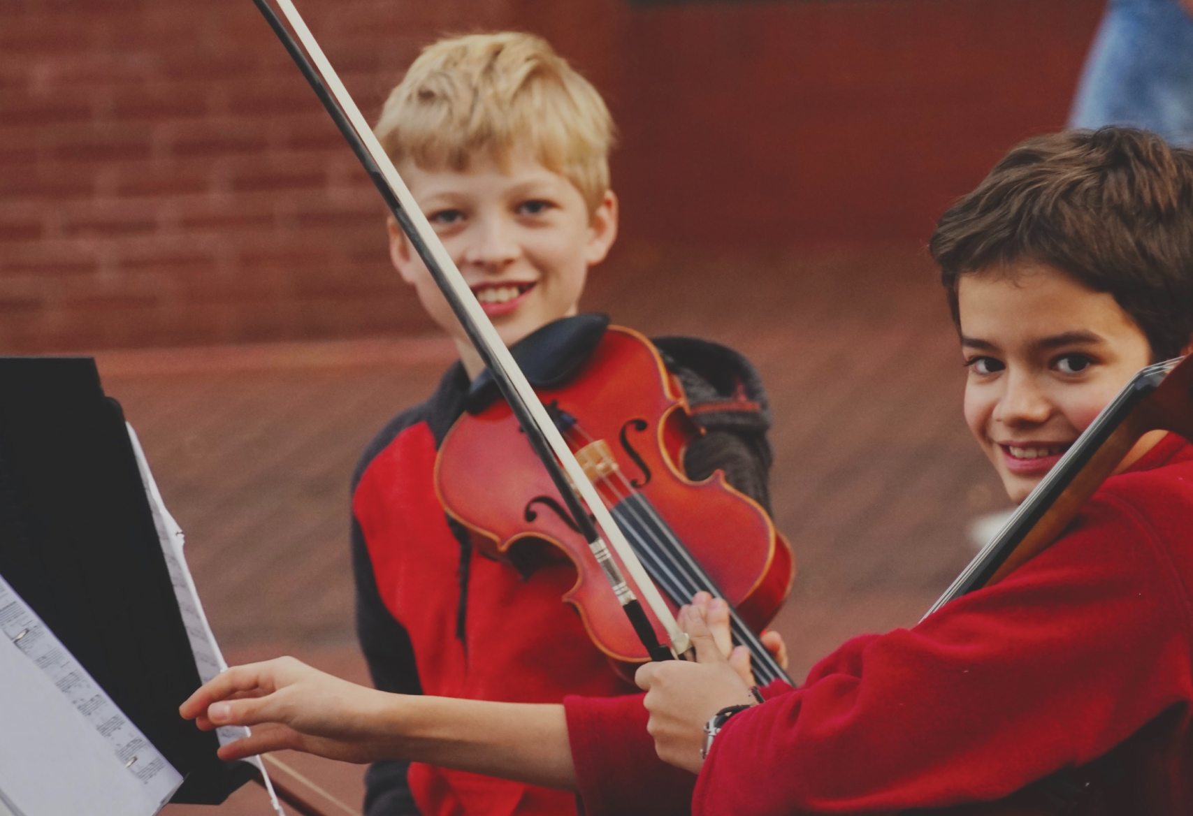 boys playing cello